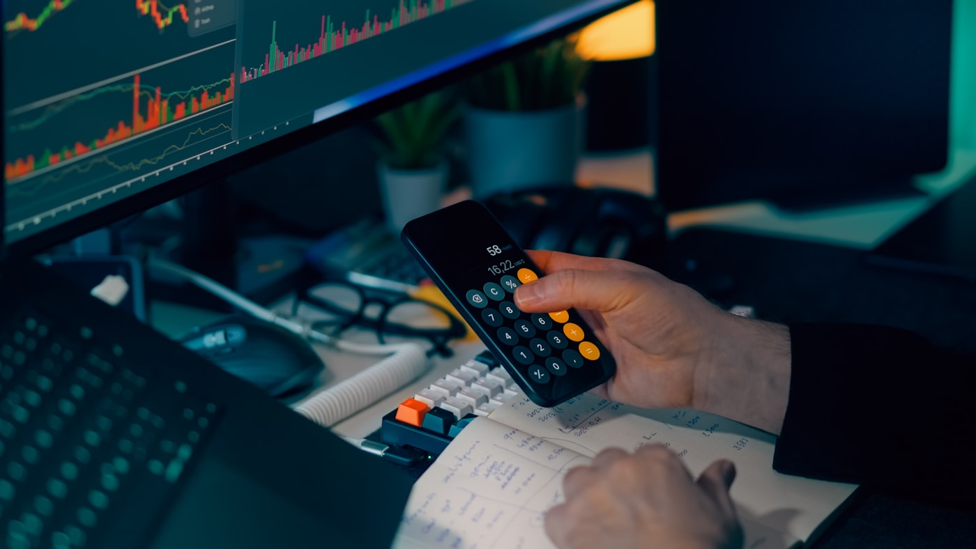 Dark finance desk with market charts